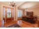 Formal dining room with hardwood floors, elegant lighting, and natural light at 152 Bay Shore Loop, Mooresville, NC 28117