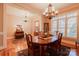Formal dining room with hardwood floors, elegant lighting, and natural light at 152 Bay Shore Loop, Mooresville, NC 28117