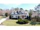 Charming two-story home with stone accents and well-manicured lawn at 152 Bay Shore Loop, Mooresville, NC 28117