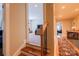 Hallway showcasing hardwood stairs leading to the upper level with views into other living spaces at 152 Bay Shore Loop, Mooresville, NC 28117