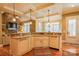 Kitchen featuring hardwood floors, granite countertops, white cabinets and coffered ceiling at 152 Bay Shore Loop, Mooresville, NC 28117