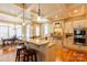 Well-lit kitchen featuring hardwood floors, granite countertops, stainless steel appliances, and breakfast bar seating at 152 Bay Shore Loop, Mooresville, NC 28117