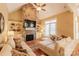 Inviting living room showcasing a stone fireplace, built-in shelving, and hardwood floors at 152 Bay Shore Loop, Mooresville, NC 28117