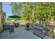 Lush backyard with a large grill and outdoor dining area, great for barbecues at 15237 Red Canoe Way, Charlotte, NC 28278
