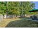 Relaxing backyard with a hammock, outdoor table, and landscaped greenery at 15237 Red Canoe Way, Charlotte, NC 28278