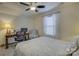 Comfortable bedroom featuring a desk and chair and a neutral color scheme at 15237 Red Canoe Way, Charlotte, NC 28278