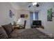 Comfortable bedroom featuring a desk, television, and relaxing ambiance at 15237 Red Canoe Way, Charlotte, NC 28278