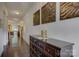 Entry hall featuring hardwood floors and decorative wall art at 15237 Red Canoe Way, Charlotte, NC 28278