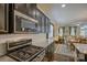 Open-concept kitchen with granite countertops, stainless steel appliances, and an eat-in area at 15237 Red Canoe Way, Charlotte, NC 28278