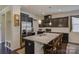 Modern kitchen features dark wood cabinets, granite countertops, and stainless steel appliances at 15237 Red Canoe Way, Charlotte, NC 28278