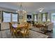 Spacious living room with fireplace, hardwood floors, and plenty of natural light at 15237 Red Canoe Way, Charlotte, NC 28278