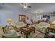 Open-concept living area with hardwood floors, comfortable seating, and elegant decor at 15237 Red Canoe Way, Charlotte, NC 28278