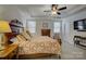 Spacious main bedroom featuring tray ceiling, large windows, and neutral-colored carpet at 15237 Red Canoe Way, Charlotte, NC 28278