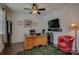 Home office with hardwood floors, a ceiling fan, and a built-in bookcase at 15237 Red Canoe Way, Charlotte, NC 28278