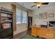 Bright office space with hardwood flooring, ceiling fan, and ample natural light at 15237 Red Canoe Way, Charlotte, NC 28278