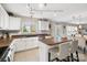 Bright kitchen featuring stainless steel appliances, a center island with seating, and an open view to the living space at 15320 Yellowstone Springs Ln, Charlotte, NC 28273