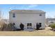 Backyard featuring a large patio, sliding glass doors, and minimal landscaping at 1612 Beleek Ridge Ln, Clover, SC 29710