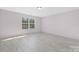 Bright bedroom with hardwood flooring and a large window that offers lots of natural light at 1612 Beleek Ridge Ln, Clover, SC 29710