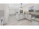 Stylish kitchen with a center island, stainless steel appliances, and light wood flooring at 1612 Beleek Ridge Ln, Clover, SC 29710