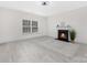 Inviting living room with fireplace, neutral walls and light wood floors, great for relaxation at 1612 Beleek Ridge Ln, Clover, SC 29710