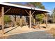 Community pavilion with picnic tables overlooking a pond and trees at 1612 Beleek Ridge Ln, Clover, SC 29710