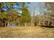 Picturesque pond surrounded by mature trees with reflections on the water at 1612 Beleek Ridge Ln, Clover, SC 29710