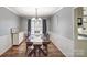 Elegant dining room with hardwood floors, chandelier lighting, and wainscoting at 1756 Wellington Ave, Newton, NC 28658