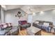 Comfortable living room featuring hardwood floors, vaulted ceiling, and plush seating at 1756 Wellington Ave, Newton, NC 28658