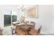 Dining room with a chandelier, large window and stylish seating arrangements at 200 J.P. Dr # 184P, Albemarle, NC 28001