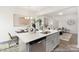 Open concept kitchen with stainless steel dishwasher and an eat-in island at 200 J.P. Dr # 184P, Albemarle, NC 28001