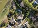 Aerial view of a home with a mature treeline and a pond on the property at 2009 Whippoorwill Ln, Indian Trail, NC 28079