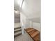 Attic storage area with carpeted stairs and a small hardwood floor space at 2009 Whippoorwill Ln, Indian Trail, NC 28079