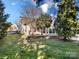Backyard featuring a lush lawn, mature trees and a view of the home at 2009 Whippoorwill Ln, Indian Trail, NC 28079