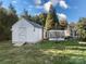 Spacious backyard features a shed and screened-in porch area, perfect for outdoor activities and relaxation at 2009 Whippoorwill Ln, Indian Trail, NC 28079