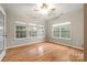 Bright bedroom with multiple windows and hardwood floors at 2009 Whippoorwill Ln, Indian Trail, NC 28079