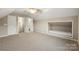 Bonus room with dormer space, patterned carpeting, and bright white trim at 2009 Whippoorwill Ln, Indian Trail, NC 28079