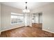 Bright dining area with hardwood floors and a view of the kitchen at 2009 Whippoorwill Ln, Indian Trail, NC 28079
