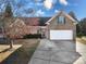 Charming brick home with a well-maintained lawn and a two-car garage at 2009 Whippoorwill Ln, Indian Trail, NC 28079