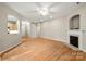 Spacious living area with hardwood floors, fireplace, and open layout at 2009 Whippoorwill Ln, Indian Trail, NC 28079