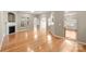 Open living area with hardwood floors, fireplace, and plenty of natural light at 2009 Whippoorwill Ln, Indian Trail, NC 28079