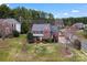 Aerial view of a brick home with lush green lawn at 204 Silvercliff Dr, Mount Holly, NC 28120
