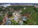 A neighborhood aerial view featuring many trees, roads, and beautiful homes at 204 Silvercliff Dr, Mount Holly, NC 28120