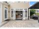 Back patio with open french doors to the home's interior at 204 Silvercliff Dr, Mount Holly, NC 28120