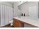 Bathroom features a wood vanity with white countertop and a large mirror at 204 Silvercliff Dr, Mount Holly, NC 28120