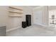 Neutral bedroom with floating shelves and double-door closet at 204 Silvercliff Dr, Mount Holly, NC 28120