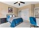 Bright bedroom with a ceiling fan, two windows, and a desk and chair at 204 Silvercliff Dr, Mount Holly, NC 28120