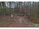 Walkway through the woods with a kayak storage area at 204 Silvercliff Dr, Mount Holly, NC 28120