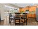 Spacious kitchen island with seating and ample natural light streaming in at 204 Silvercliff Dr, Mount Holly, NC 28120