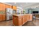 Spacious kitchen with stainless steel appliances, custom cabinets, and large central island at 204 Silvercliff Dr, Mount Holly, NC 28120