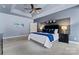 Comfortable main bedroom with ceiling fan, tray ceiling, and neutral color scheme at 204 Silvercliff Dr, Mount Holly, NC 28120